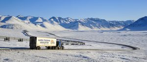 Dalton highway and oil pipeline at Atigun pass, truck, Alaska